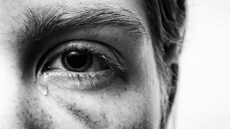 Close-up image of a man crying