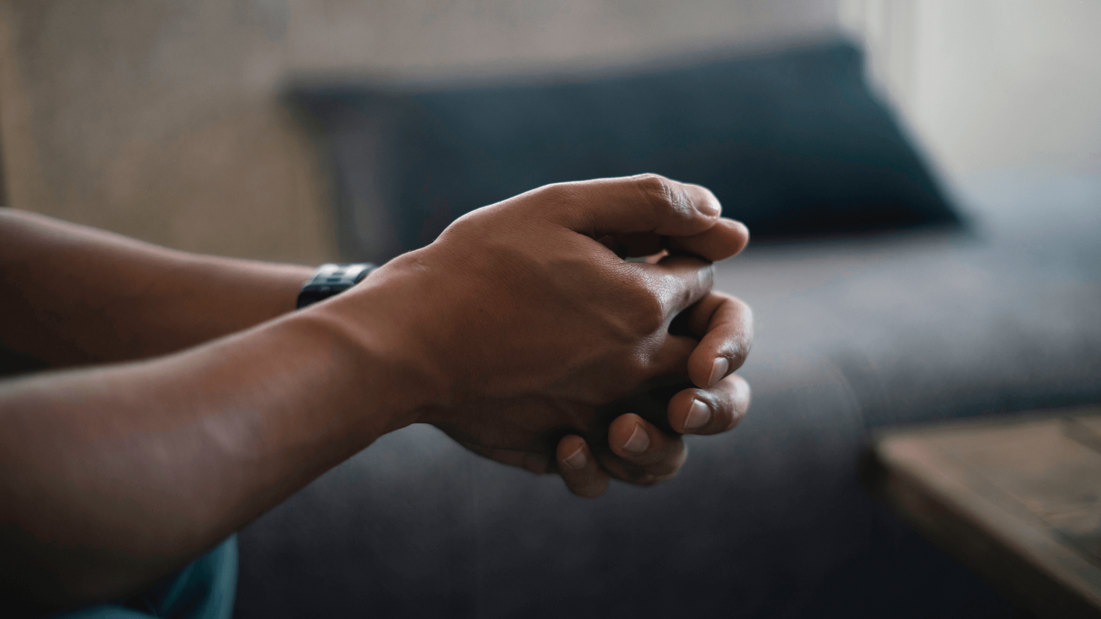 A person's clasped hands