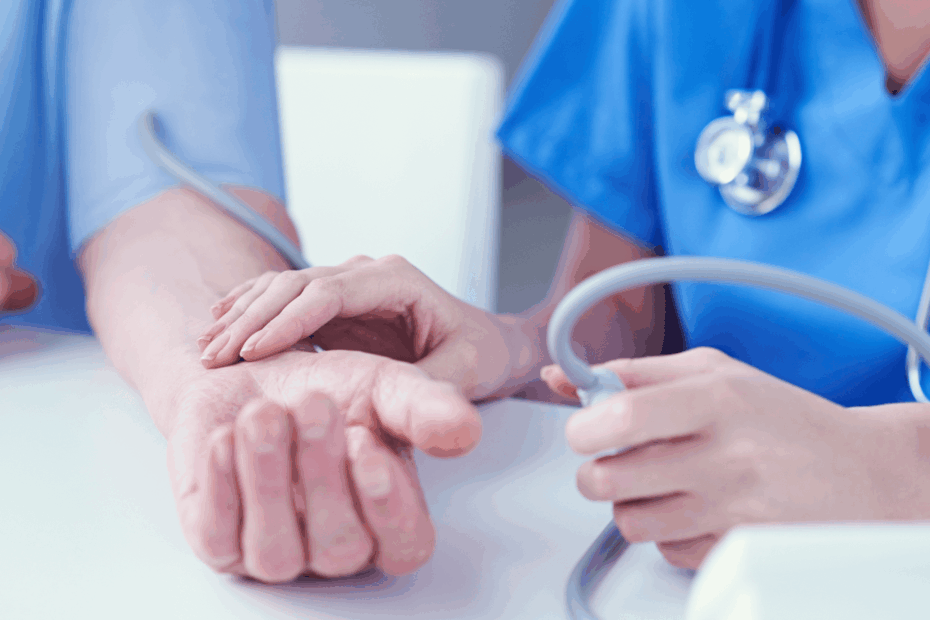A nurse taking a woman's blood pressure.