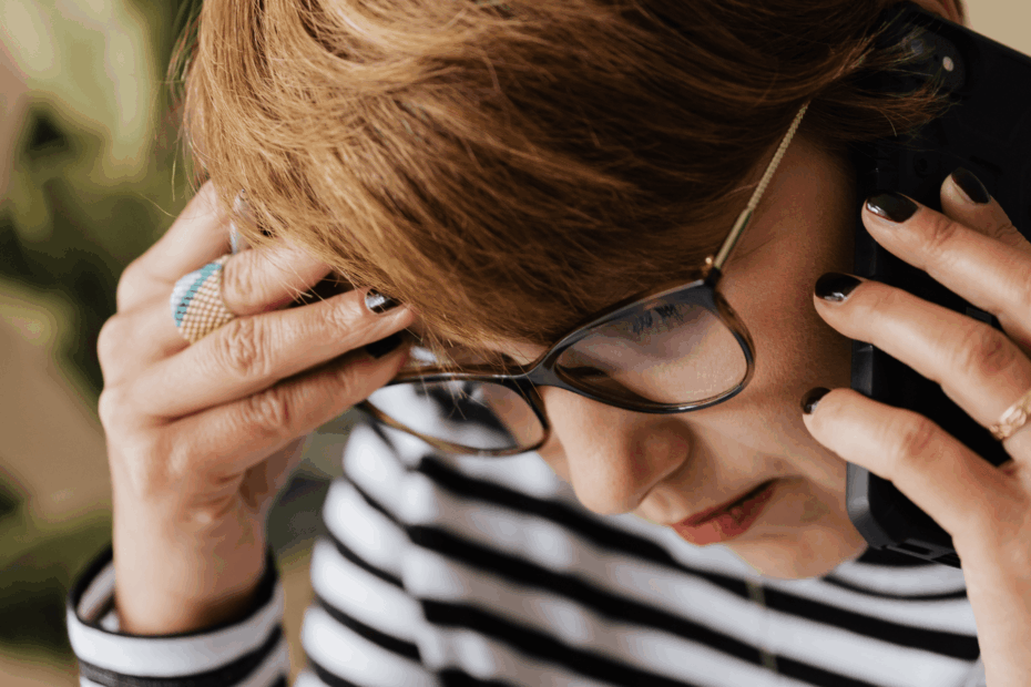 A close-up of a woman talking on the phone.