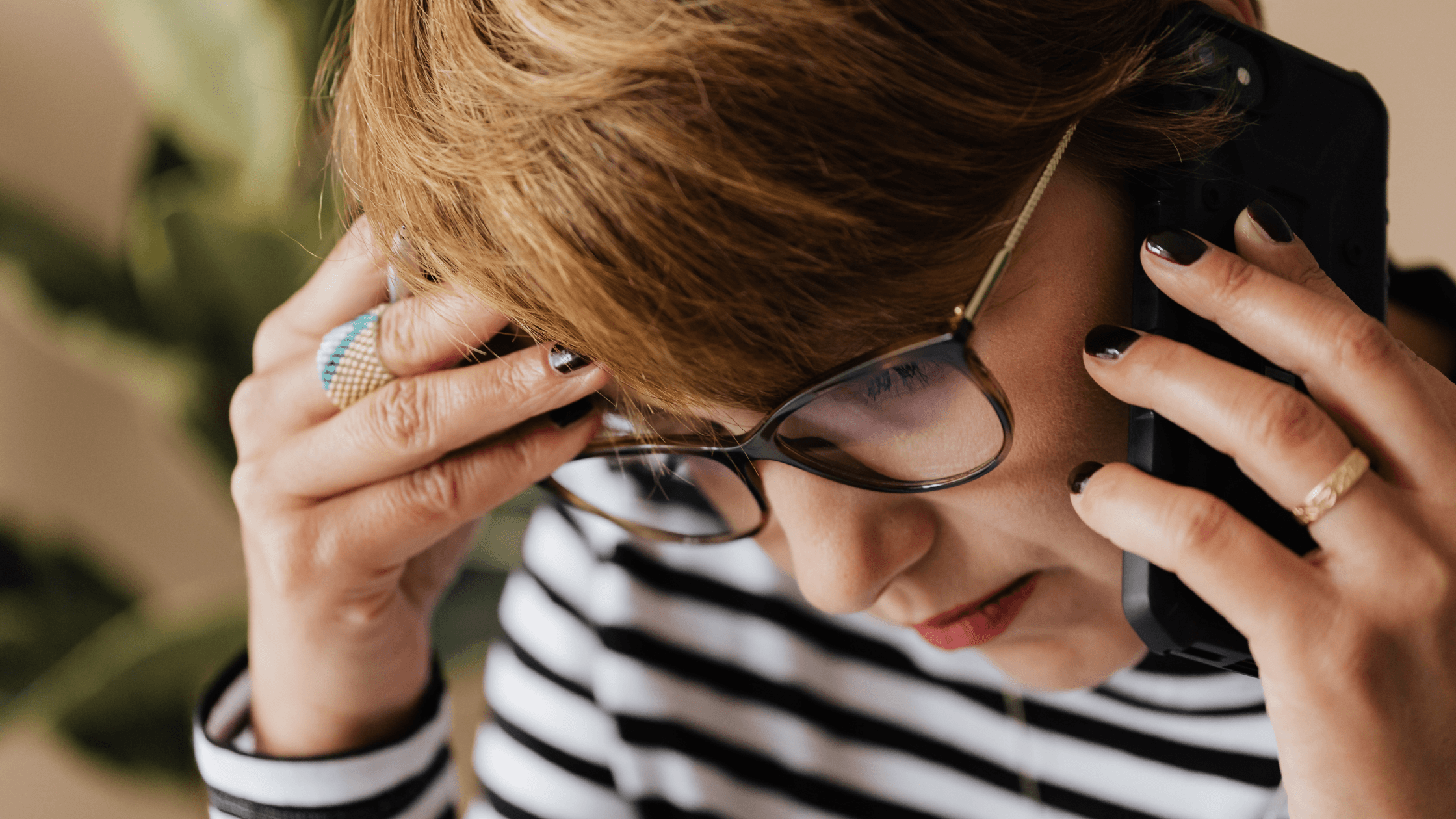 A close-up of a woman talking on the phone.