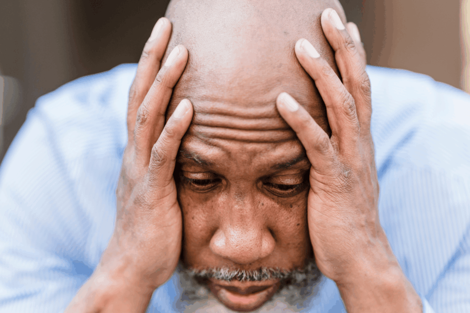 Man with his head in his hands